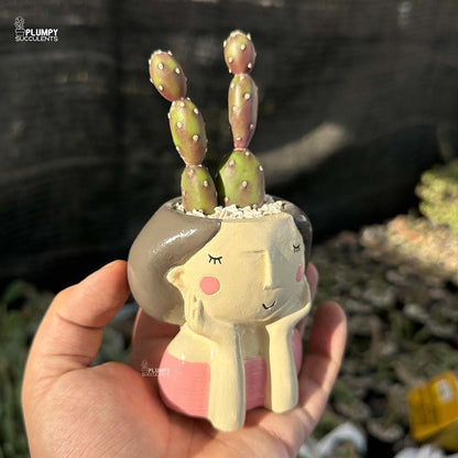 Purple Opuntia in Girl with Hands on Face Planter